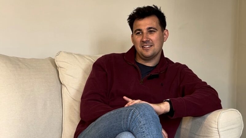 Man sat on sofa