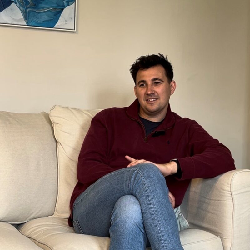 Man sat on sofa